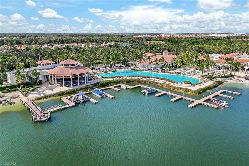 Birds eye view of property with a water view