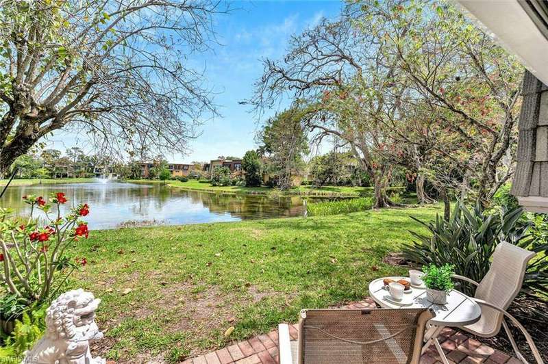 View of yard with a water view