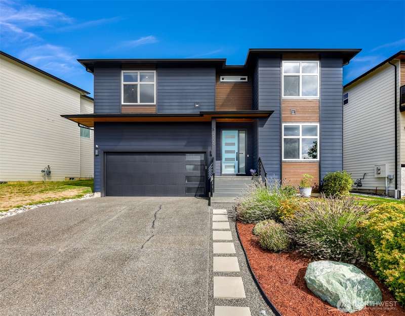 Immaculate newer construction home with beautiful landscaping.