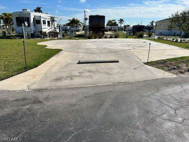Large corner lot   Nice green space and plenty of room for chairs and table etc.