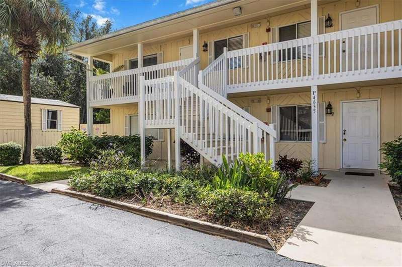 View of property with stairway