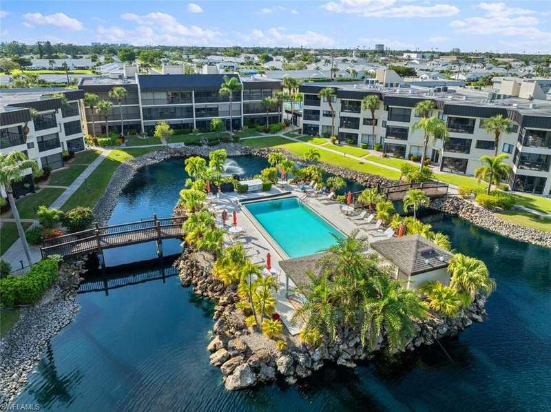 Community pool featuring a water view