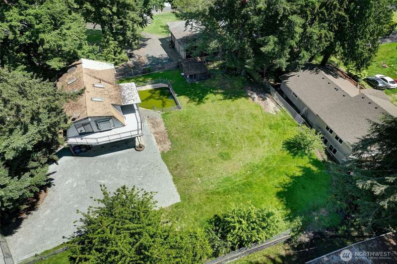 Already 2 permitted residential structures plus rentable garage. Excellent fixer & investment opp!