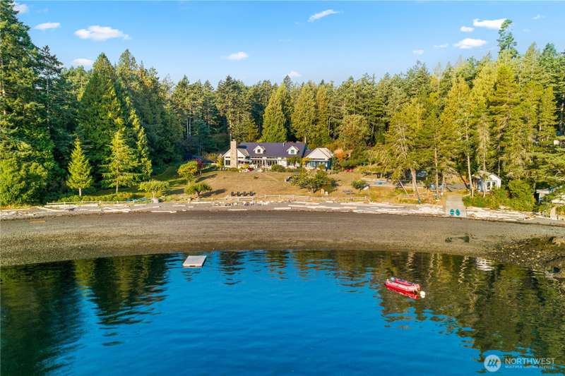 330 feet of private soft pebble beach in Rocky Bay. World class crabbing and spotted prawn in this bay. Registered mooring buoy, anchorage in bay suitable for 150 ft yacht, plus plenty of open space to land a helicopter in the expansive front yard.