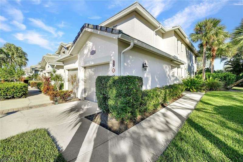 View of property exterior with a garage