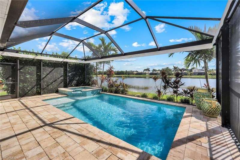 Pool and spa with a Southern exposure lake view and a screened lanai.