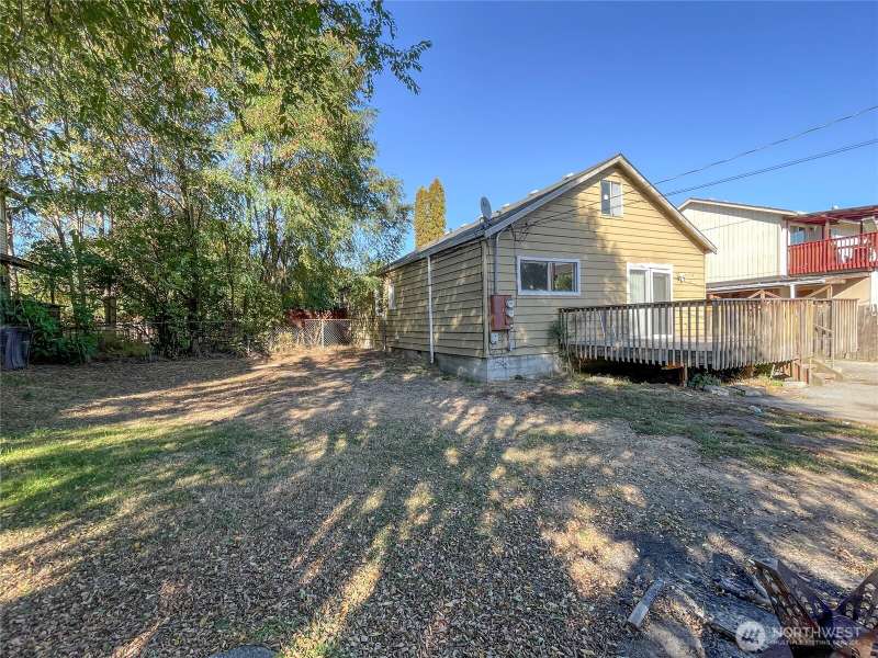 Welcome to this charming duplex on a double lot with alley access!