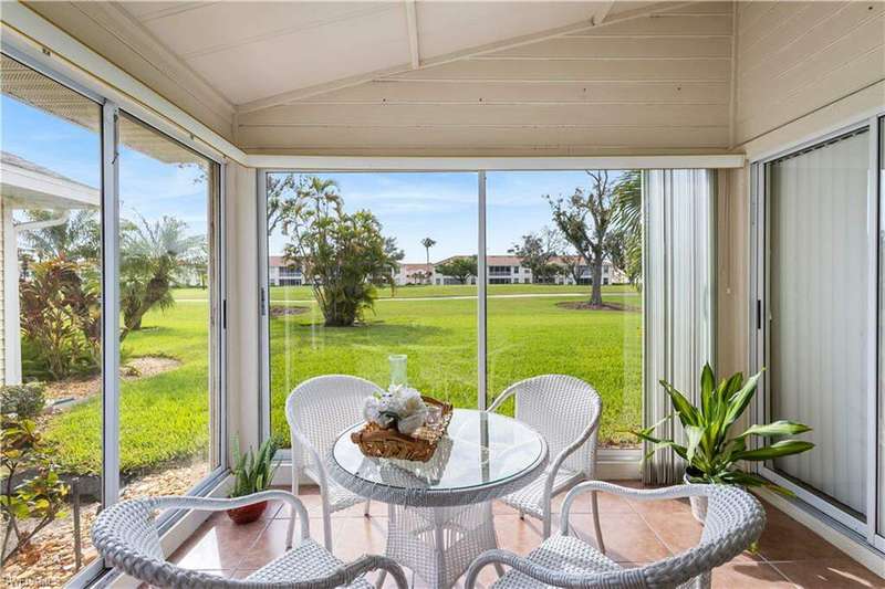 Glass enclosed Sun Room w/ sliding doors, 20 x 20 tile flooring, Private slider doors to Master Ensuite, 5th Fairway Golf coarse and landscape views