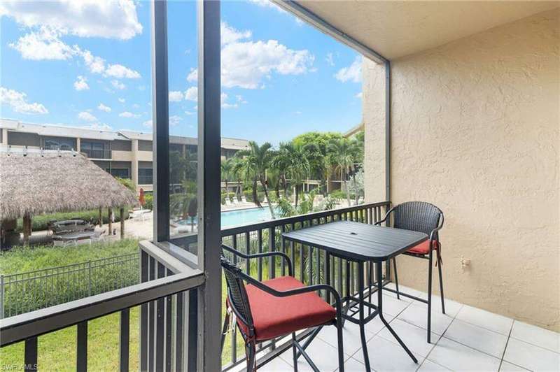 Balcony featuring a community pool