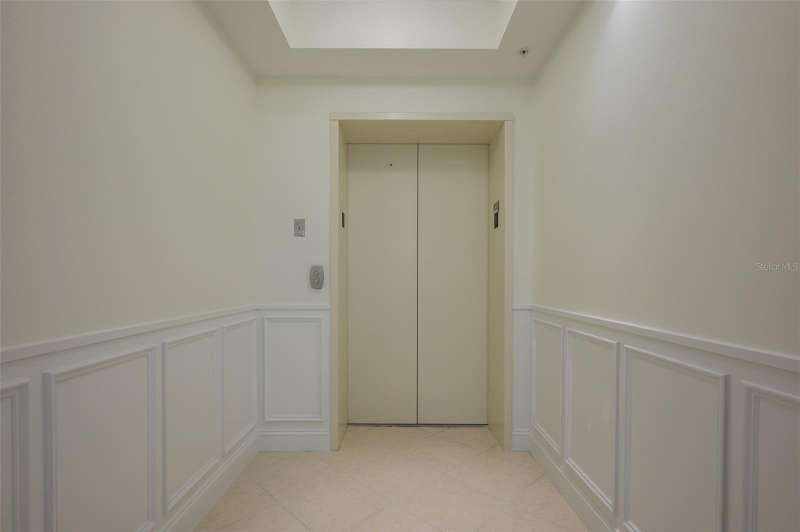 Private foyer entry with secure elevator access.