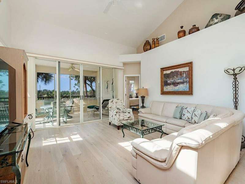 Great room open to the lanai with Golf Course views