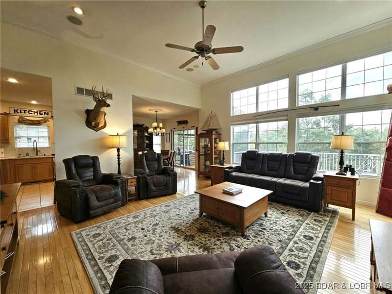 Living Room with wall of windows, vaulted ceilings