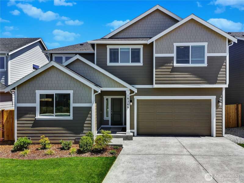 Photos are taken of a Shelby plan previously built in the community.