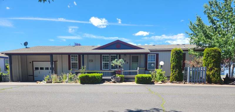 55+ Park in Suntree Village, updated and move in ready - 1242 sq ft. with insulated one car garage, patio and deck.