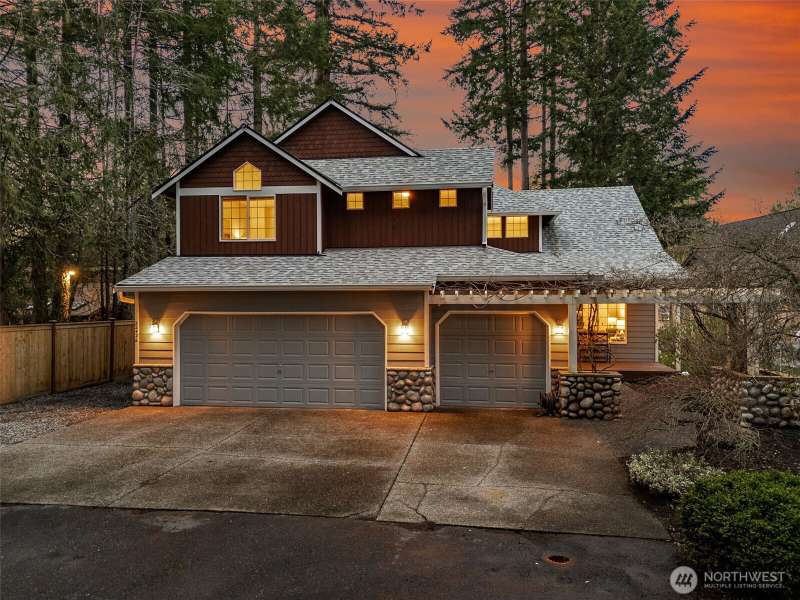Oversized 3-car garage is great for your summertime water toys! Lots of off-street parking + room for smaller RV parking to the left of the garage pad.