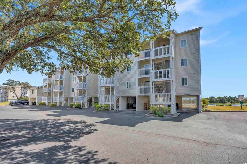 View of apartment building / complex featuring cov
