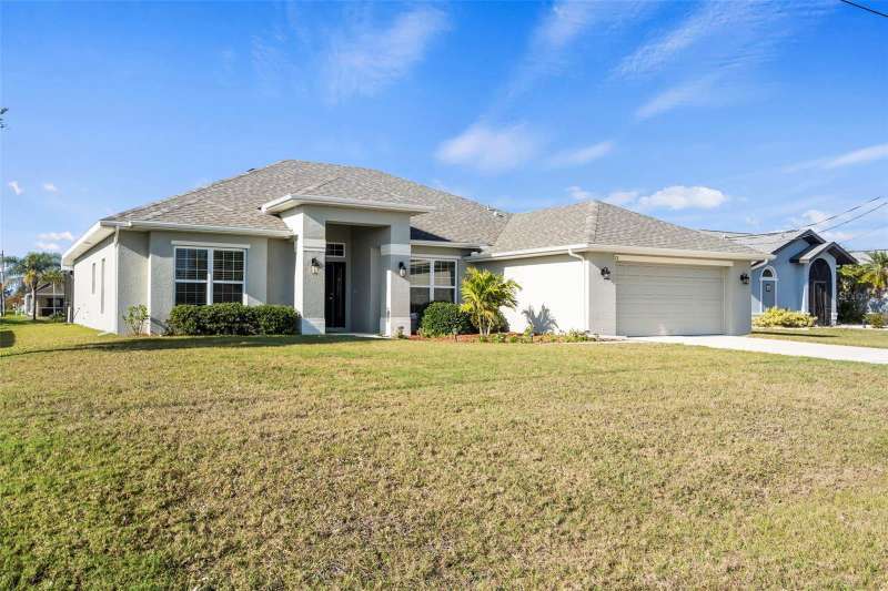 Custom home with impact resistant windows and oversized garage