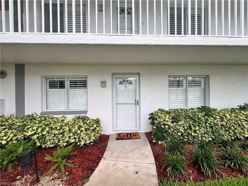 Property entrance featuring a balcony