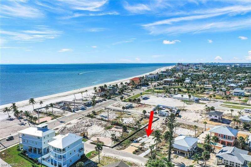 Bird's eye view with a view of the beach and a water view