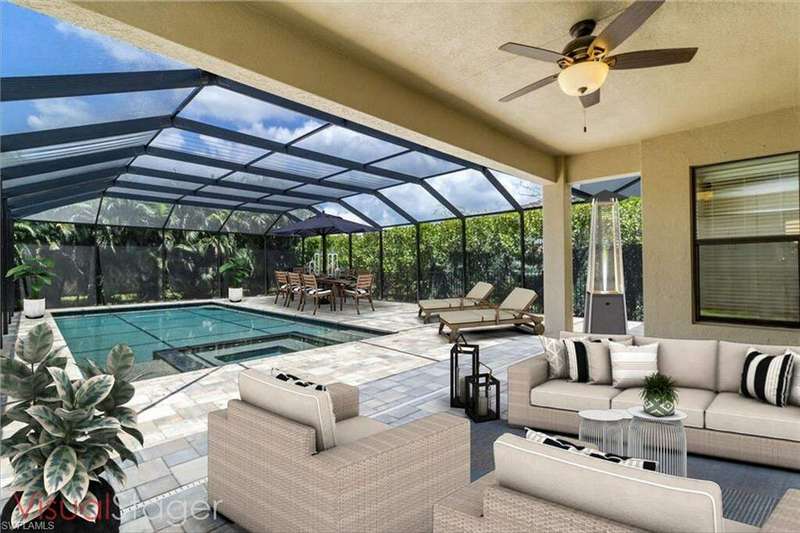 View of pool with an outdoor living space, a patio, ceiling fan, and glass enclosure