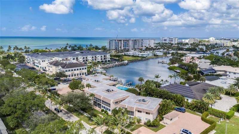 Drone / aerial view of a marina and a large body of water