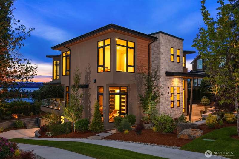 Stunning yet sophisticated NW Contemporary exterior. Low Maintenance Exterior Finishes Including Cement,Stucco with Elastomeric Finish, Natural Stone Veneer, TRESPA Siding and VG Stained Cedar Soffits