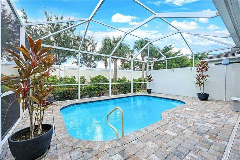 View of swimming pool featuring a lanai and a patio area