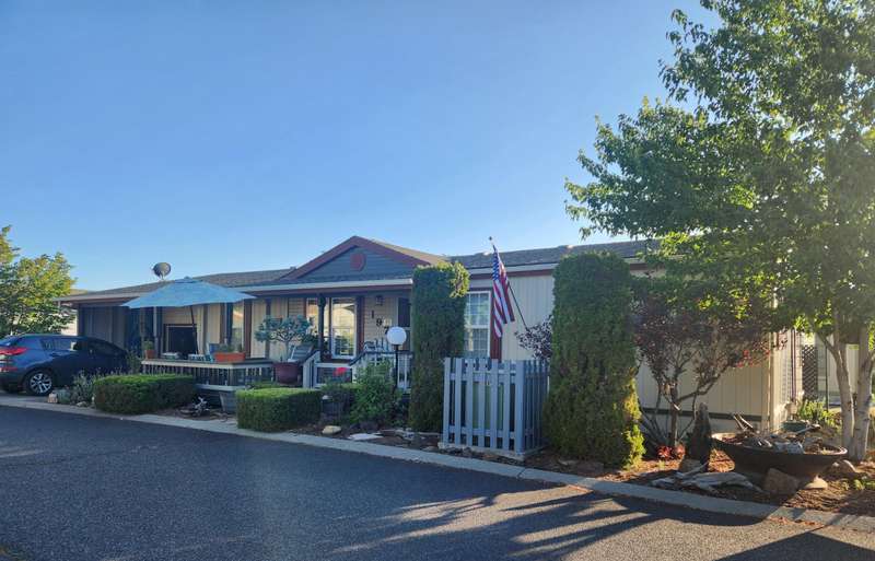 55+ Park in Suntree Village, updated and move in ready - 1242 sq ft. with insulated one car garage, patio and deck.