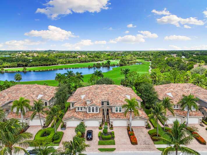 Mediterranean / spanish-style home with stucco siding, driveway, a tile roof, and an attached garage