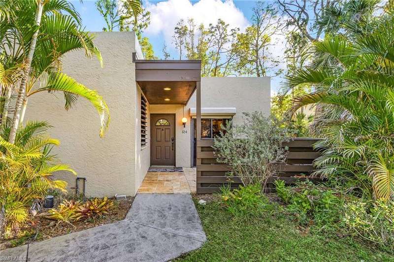 View of exterior entry featuring stucco siding