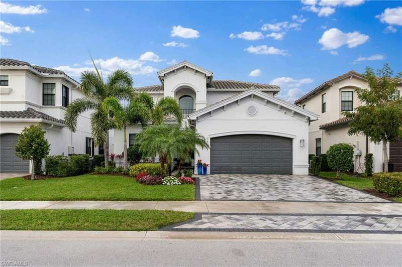 Mediterranean / spanish house featuring a front lawn