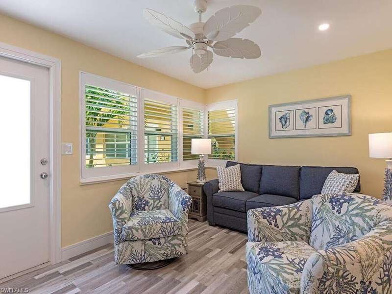 This bright and open living room welcomes you home with open arms!