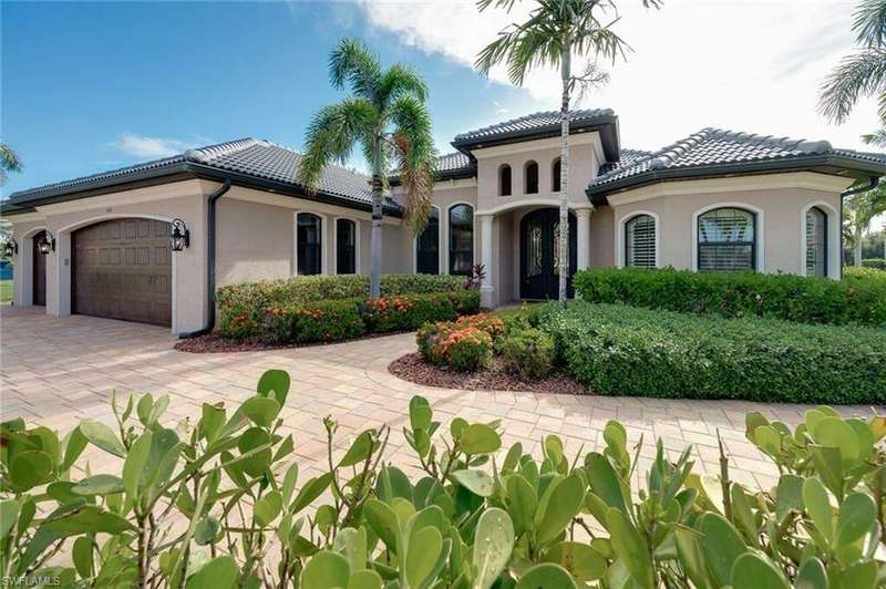 Mediterranean / spanish-style home featuring a 3 car garage.