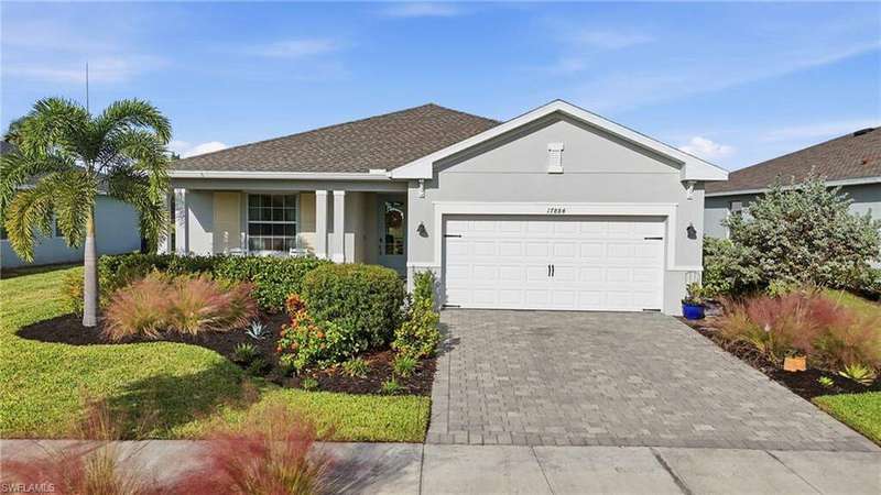 Single story home with stucco siding, decorative driveway, a garage, a shingled roof, and a porch