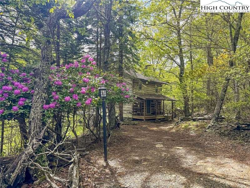 Discover this charming antique log cabin nestled q