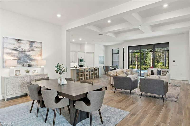 Tile wood look flooring, sliding pocket doors out to the lanai.