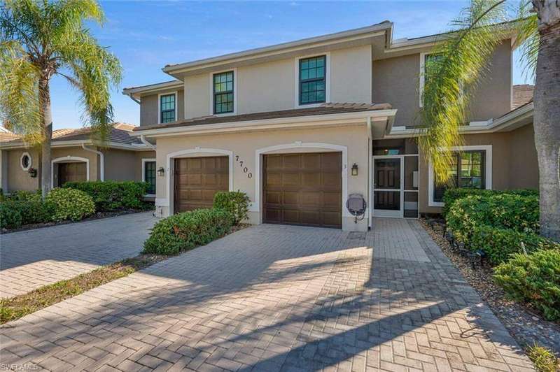 View of front of house featuring an attached one car garage