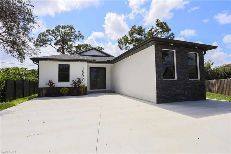 View of front facade with stone siding and stucco siding