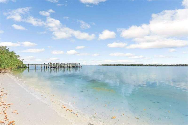 Private beach feature with a boat dock