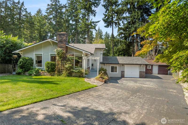 Nestled on a peaceful cul de sac steps from Lake Tapps, this updated open concept home offers 2356 sq ft on a fully fenced and gated park like setting