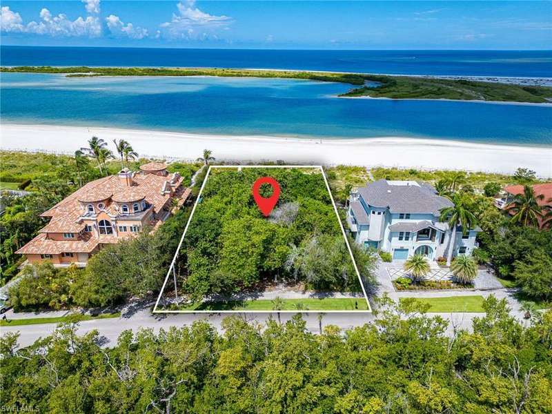 Bird's eye view featuring a water view and a beach view