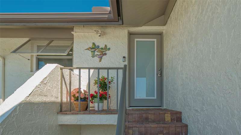 SECOND FLOOR CONDO IN DESIRABLE PELICAN HARBOUR CONDO COMPLEX