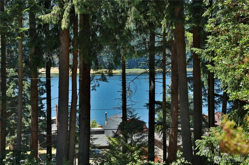 This gently sloping lot is well landscaped and partially treed.