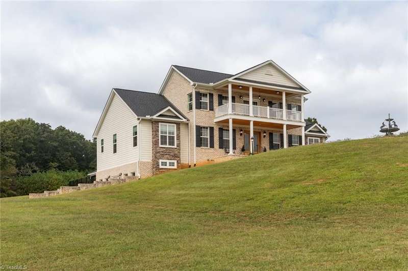 View of house and barn from pond