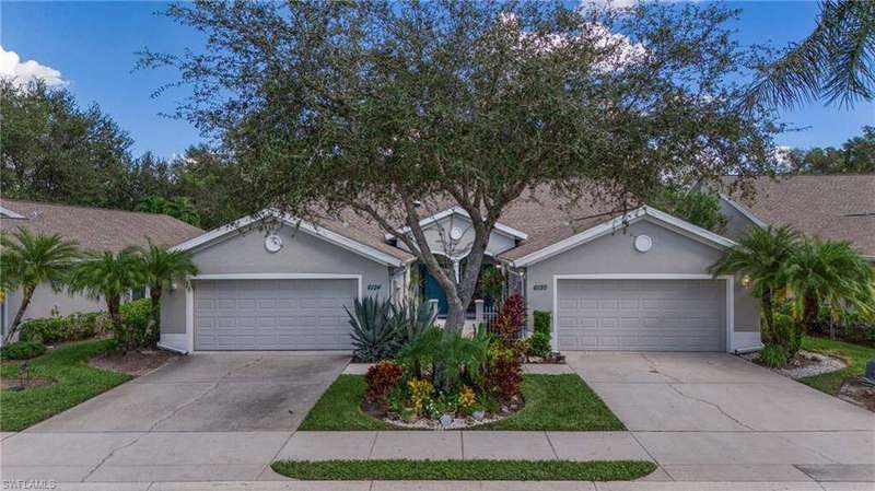 Ranch-style home with stucco siding, driveway, and an attached garage