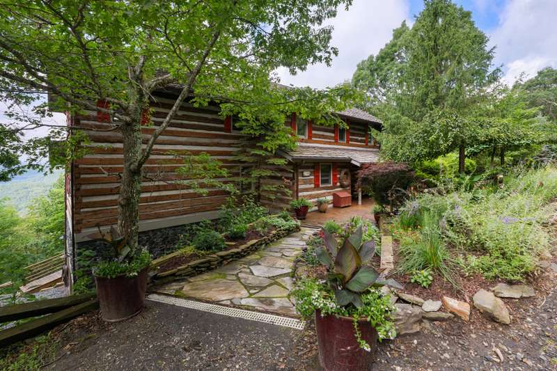 Introducing an exceptional antique log home tucked away within the captivating Stonebridge community.
