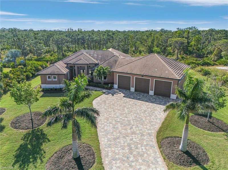 Single story home with a front yard and a garage