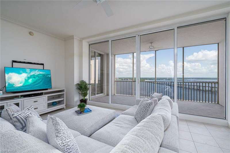 Great Room overlooking the Caloosahatchee River. Awesome view at night!