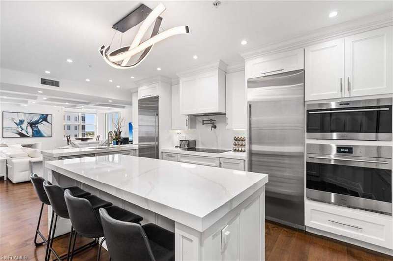 Every detail exudes luxury, from the Woodland high-end custom cabinetry,boasting a Wolf Sub-Zero induction cooktop, Wolf Sub-Zero double oven (convection and speed oven microwave ), Sub-Zero column refrigerator, column freezer, and dishwasher, a Brizo pot