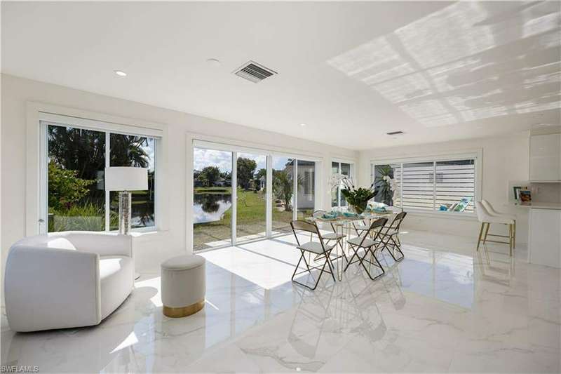 Sunroom with a water view